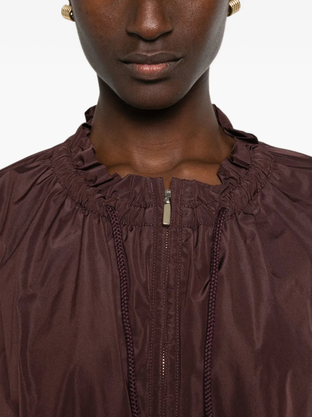 Jacket with ruffles and drawstring