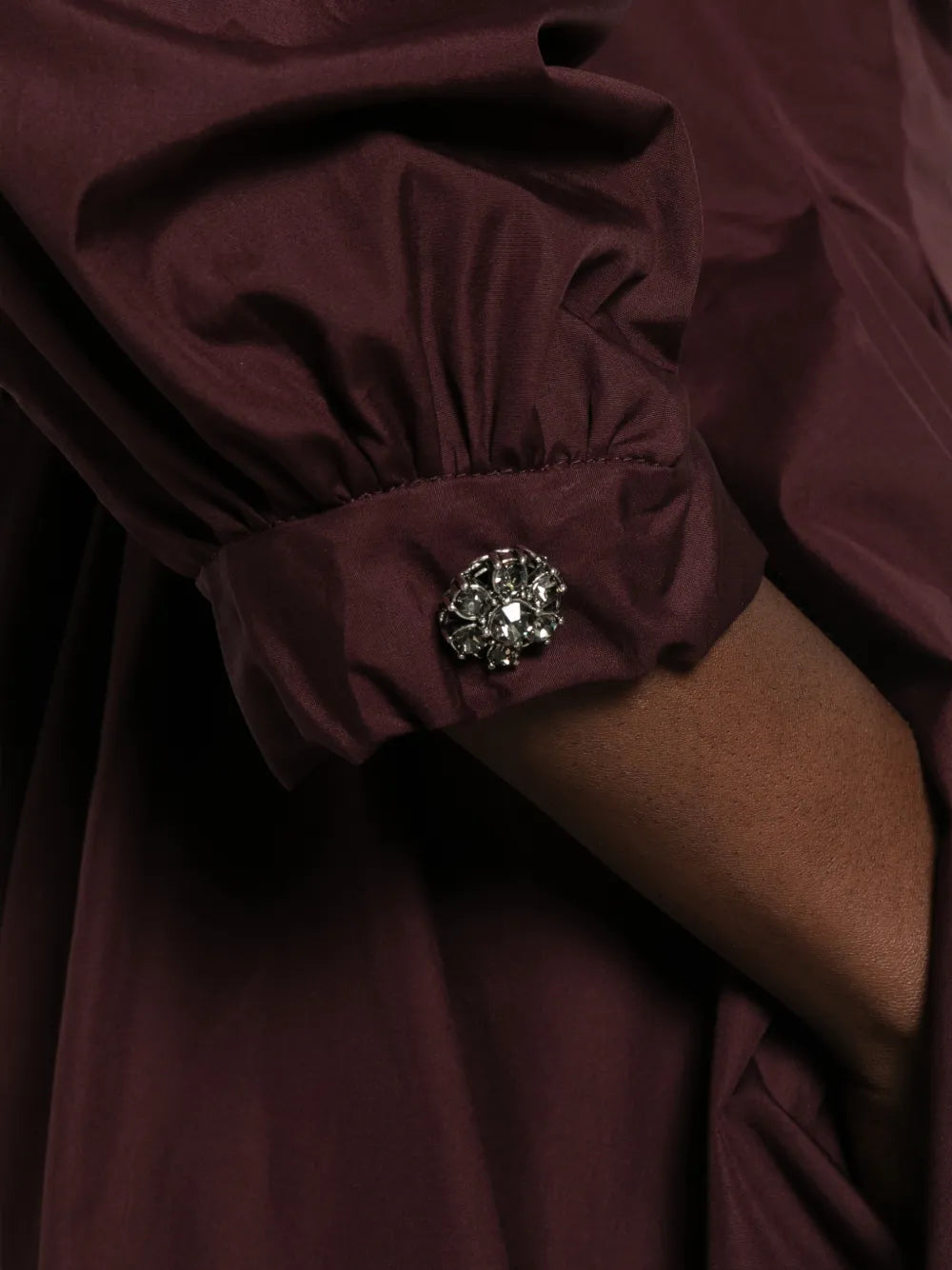 Pleated dress with crystal embellishments