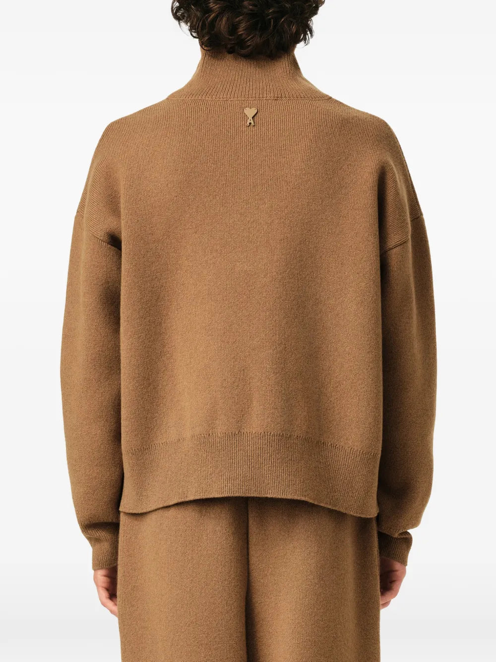 Wool sweater with high buttoned collar