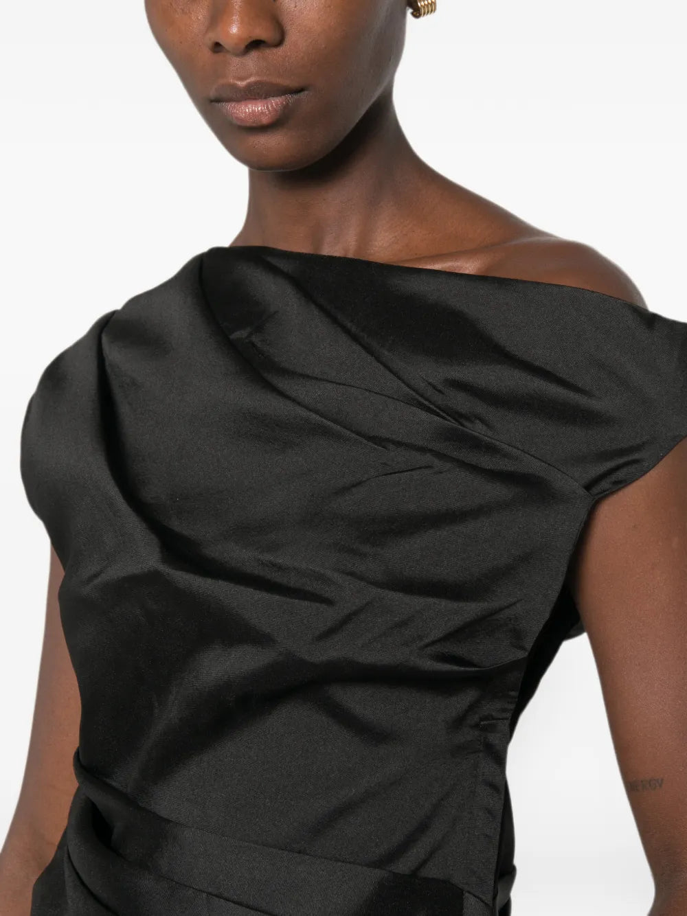 Top with asymmetrical neckline and draping
